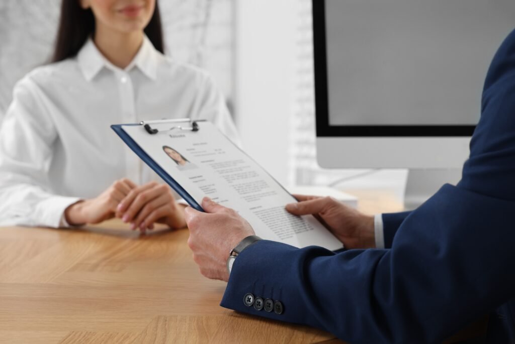 human,resources,manager,reading,applicant's,resume,in,office,,closeup human,resources,manager,reading,applicant's,resume,in,office,,closeup